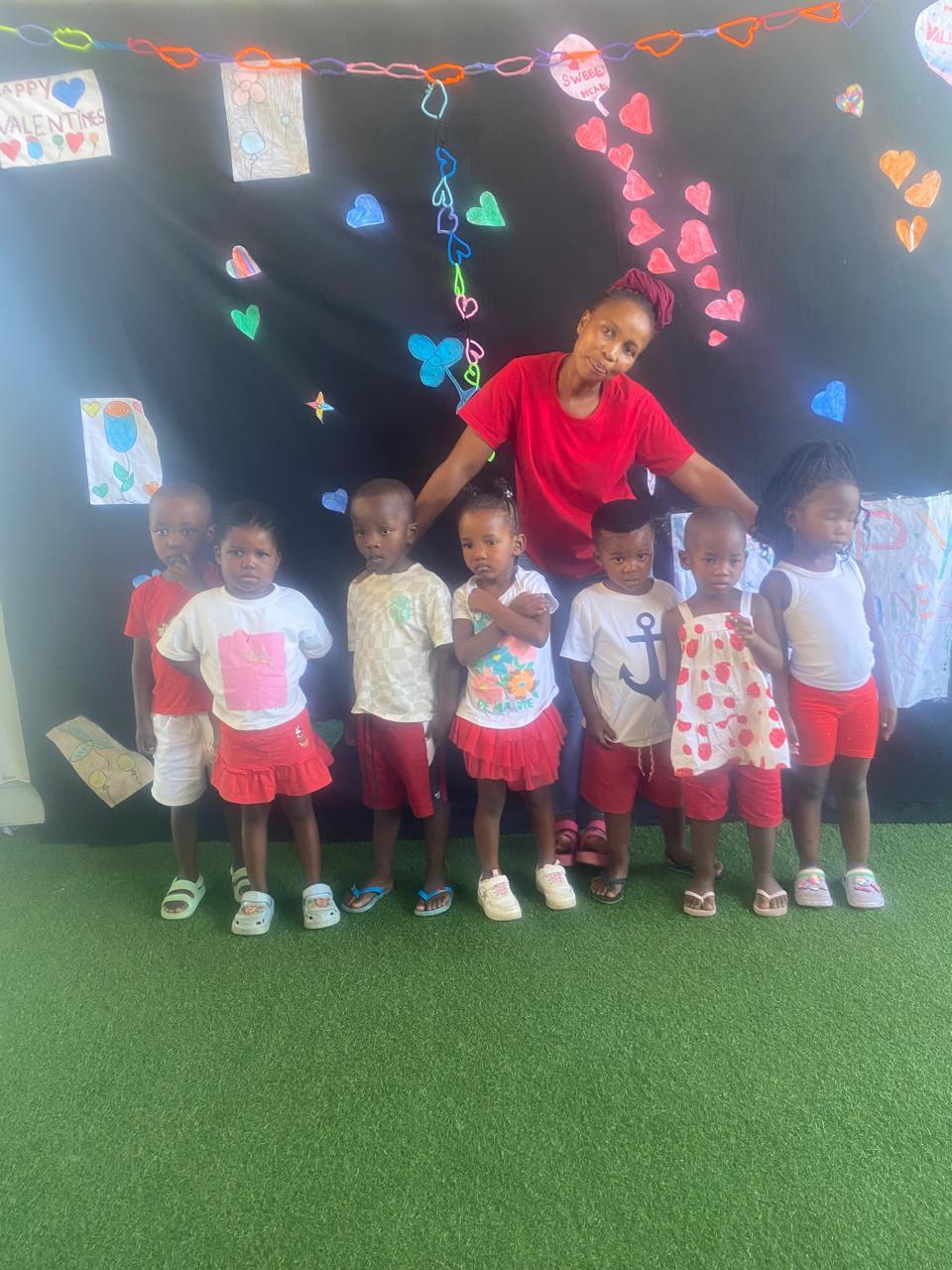 Little learners with their teacher at the Valentine's celebration